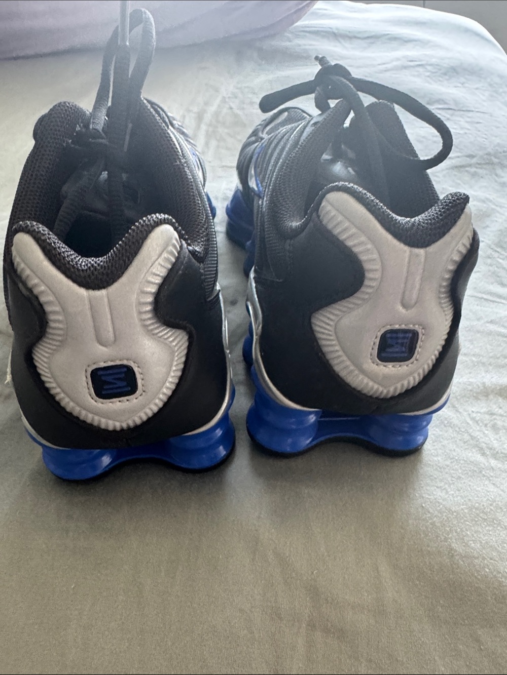 Nike Black Sneakers with Blue Accents and Cushioning Pods - Picture 7 of 8